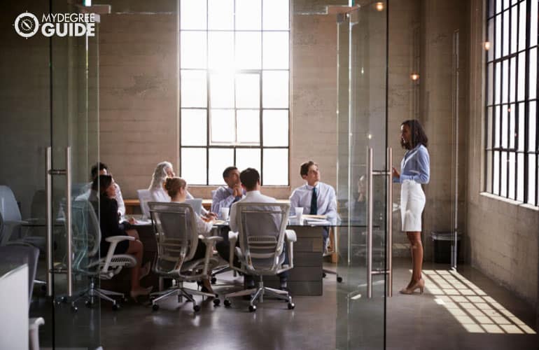 human resource manager talking to team during a meeting