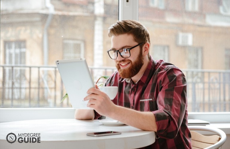 master's degree in nutrition student studying at a cafe