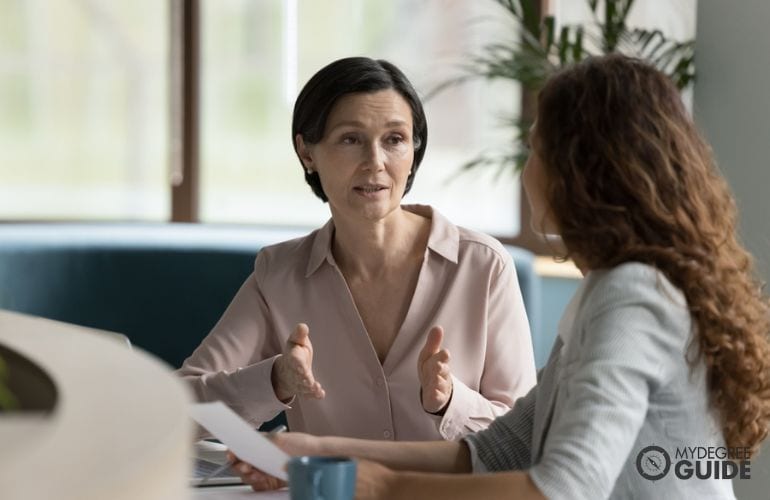 two women in a serious conversation