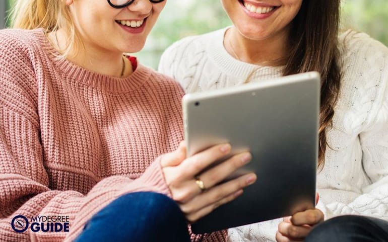 friends enjoy watching from ipad