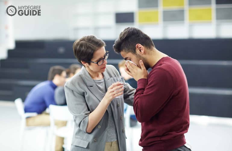 counselor comforting a patient during therapy session