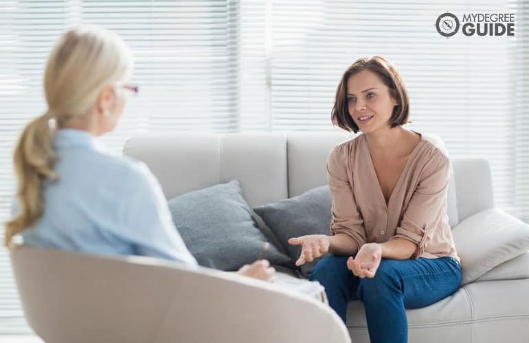 counselor and patient in office talking