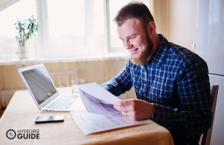 Man preparing requirements for Masters in Development Psychology 