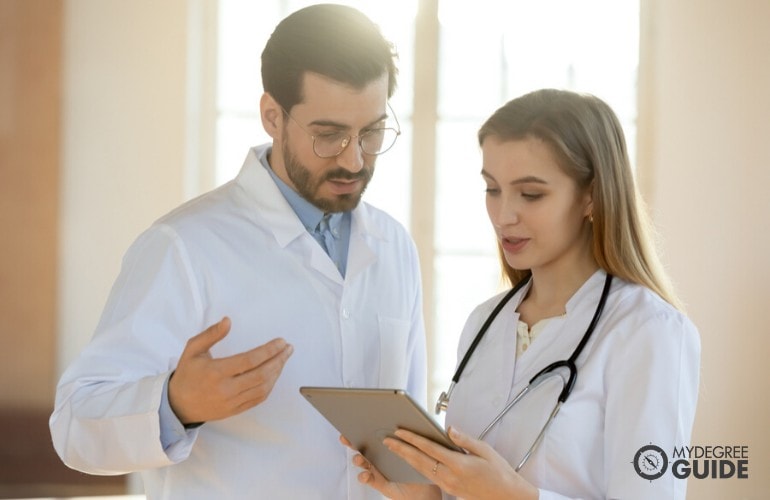 chief medical information officer talking to a chief nurse