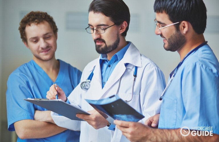 healthcare manager giving instructions to his subordinates