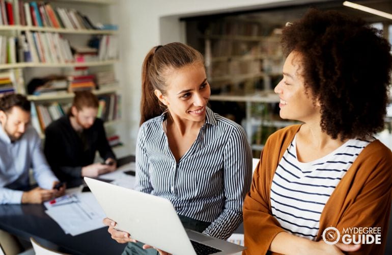 Group of people taking Human Development Master, studying together