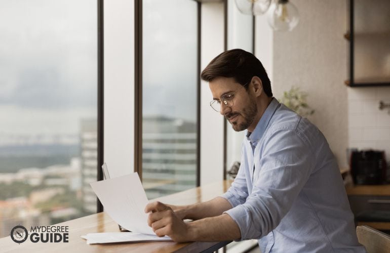 Man preparing requirements for Masters in Human Development