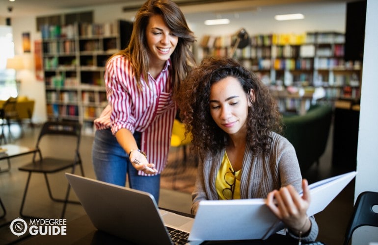 Masters in Public Administration students studying together in university library