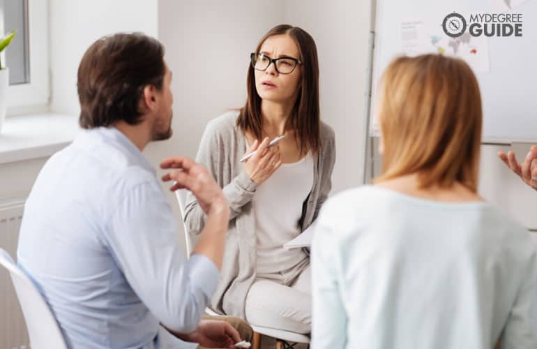 human services manager discussing with her team in a meeting