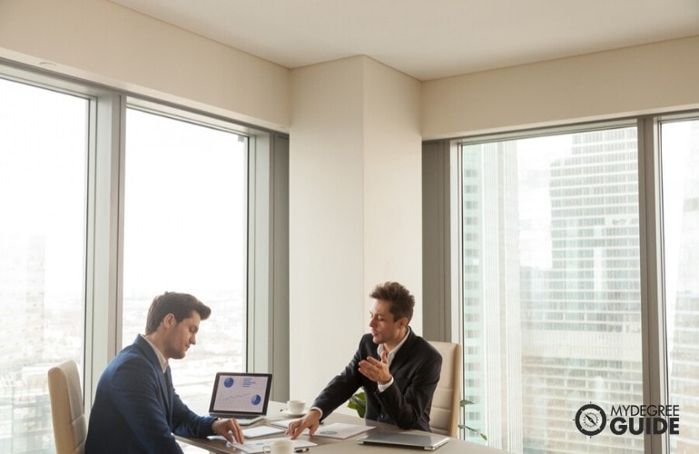 Market Research Analysts working in an office