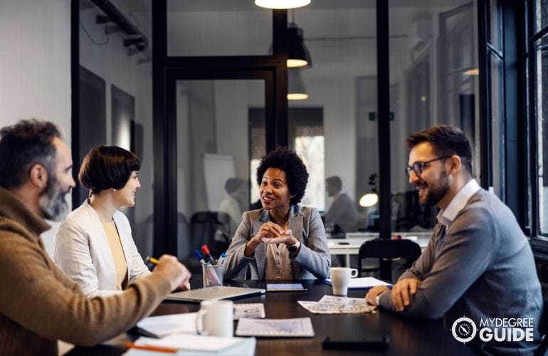 Leader speaking to employees in office