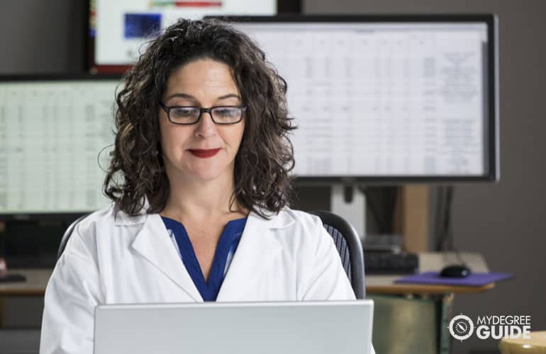 medical coder working on her laptop