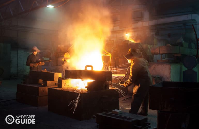 Metallurgic Engineer casting metals in a plant