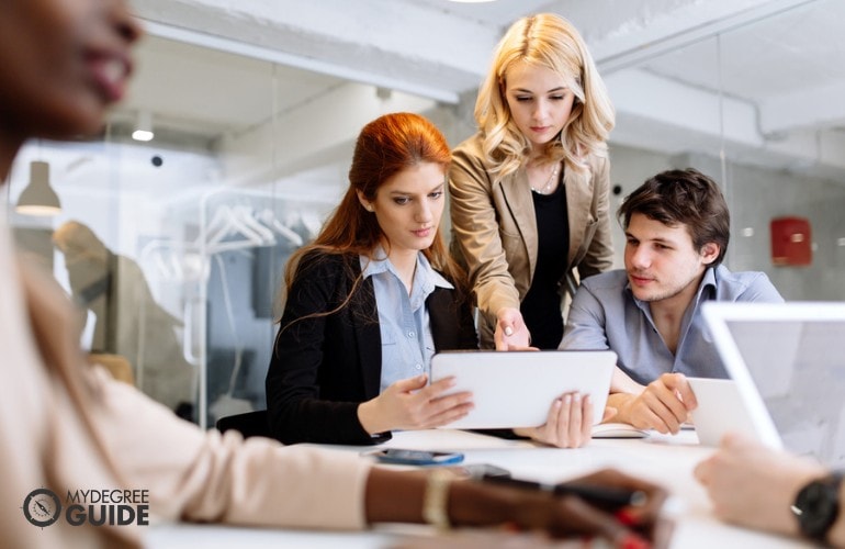 people discussing a plan in the office