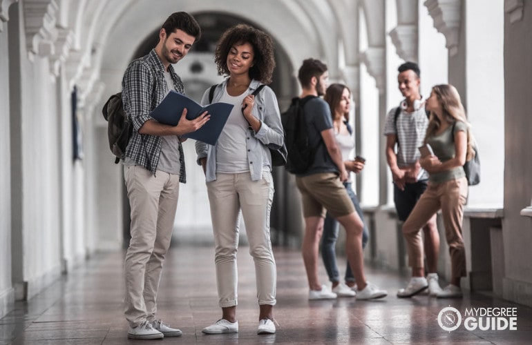 college students meeting in the hallway