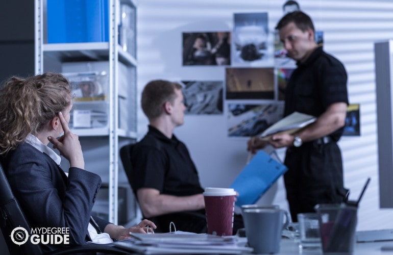 head of police officers meeting with her team