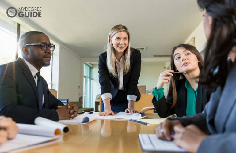 team of young professionals in a nonprofit organization in a meeting