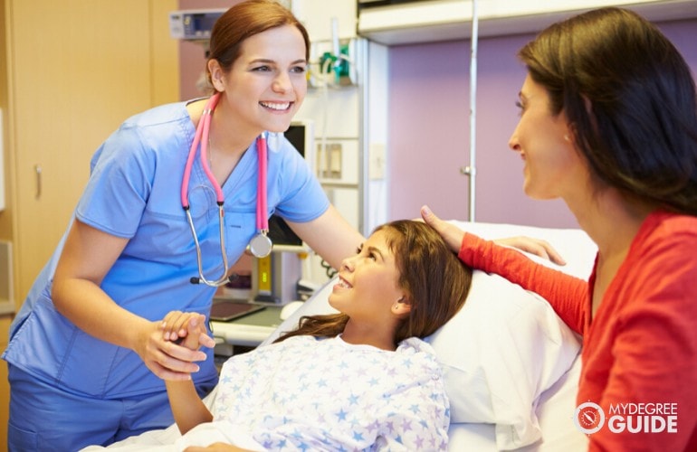 nurse checking on a patient in the hospital