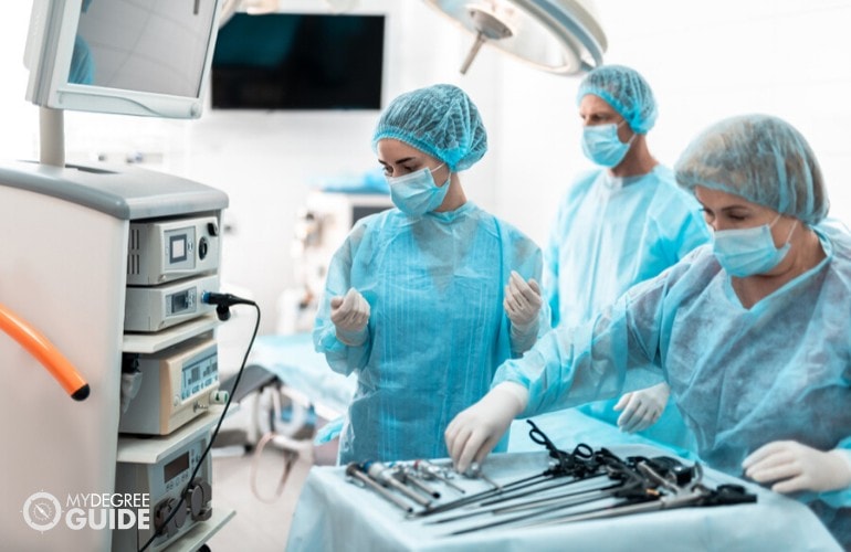 Nurses helping the doctor during operation