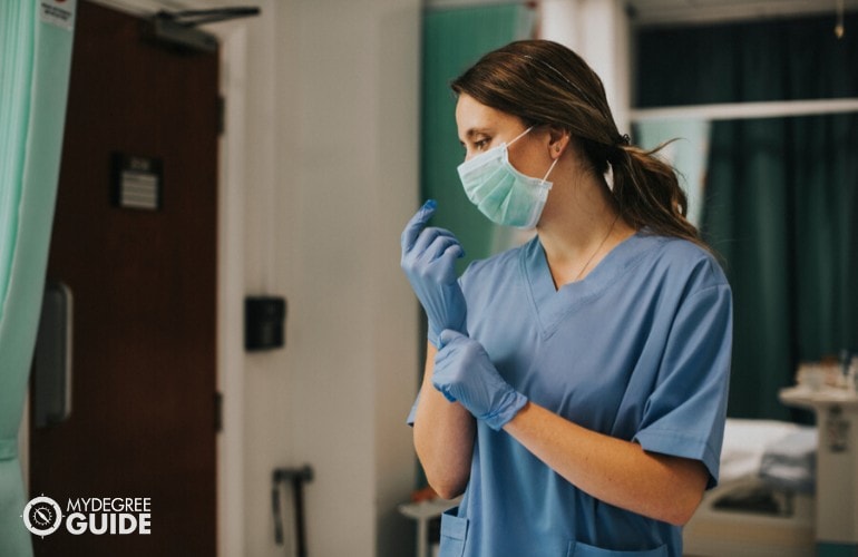 nurse wearing mask and gloves while on duty