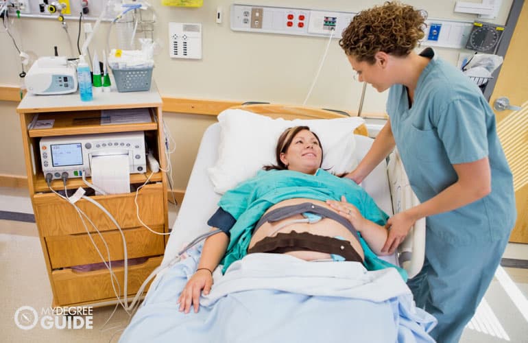 nurse taking care of a pregnant woman