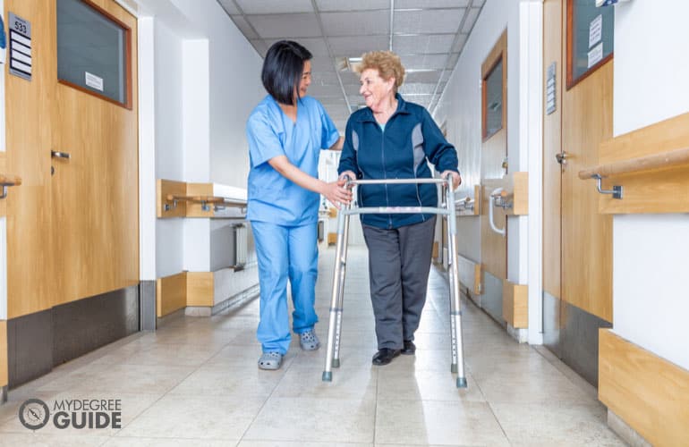 female nurse helping an elderly patient