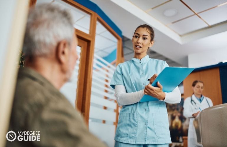 Nursing Assistant checking a patient