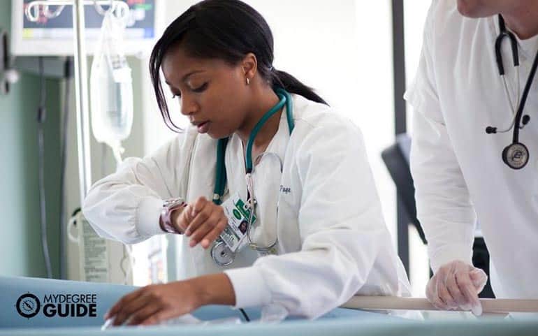 nursing staff taking patient's vital signs