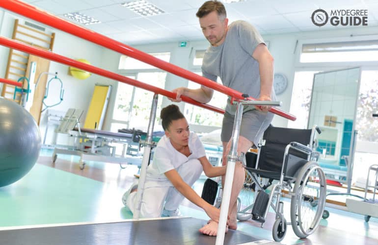 occupational therapist helping a patient during therapy session