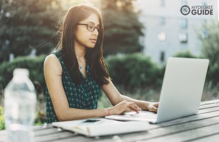 bachelor's degree student working on her laptop