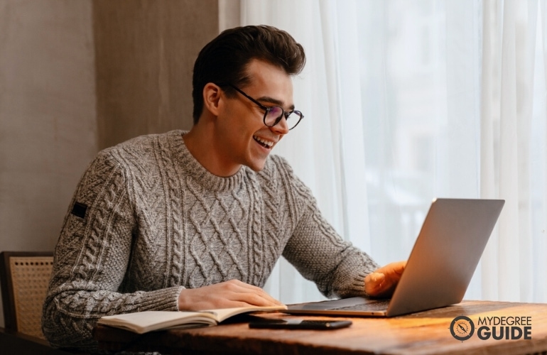 Man taking Online Bachelor’s in Health Services Degree