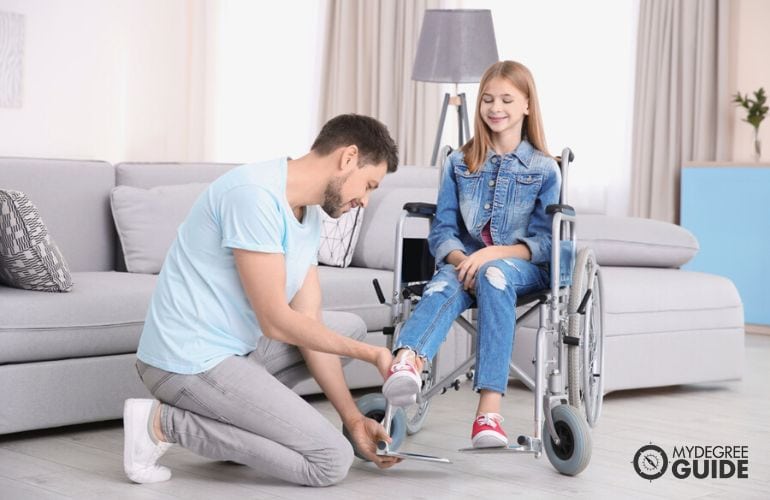 Kinesiologist examining an injured child