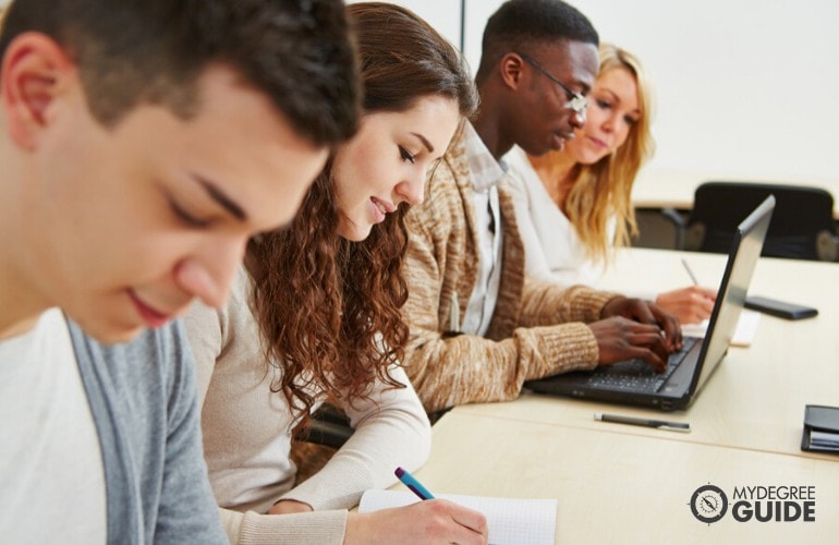 Computer Engineering students studying together in class