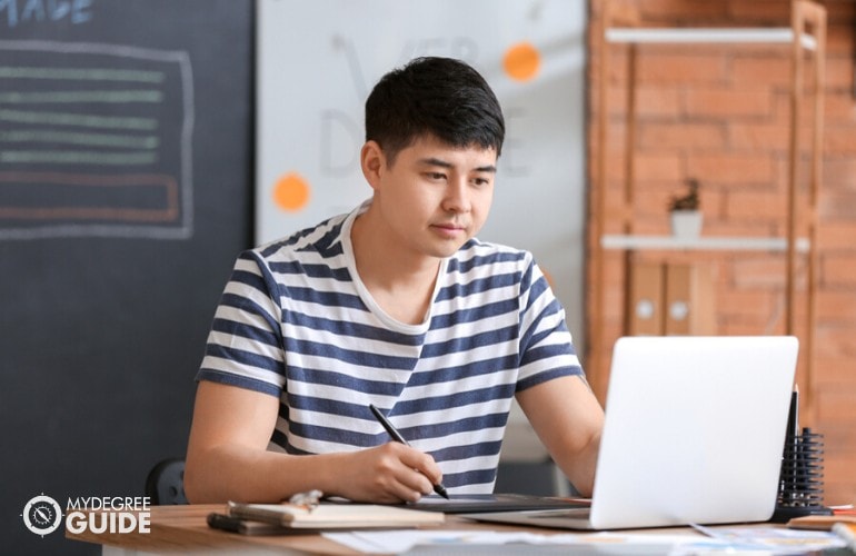 computer science student studying at home