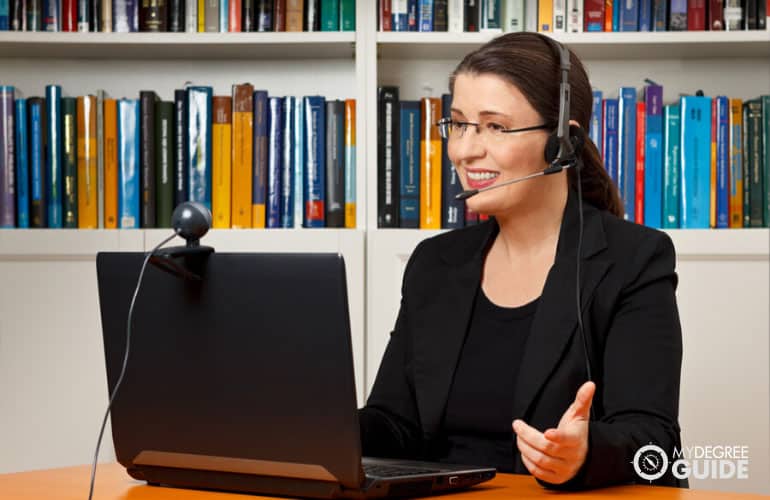 online teacher having a class in front of her computer