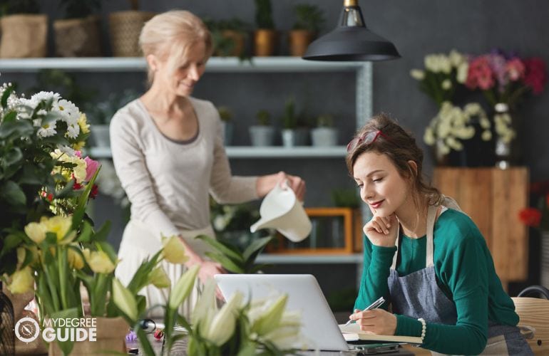 Entrepreneur checking orders from online portal