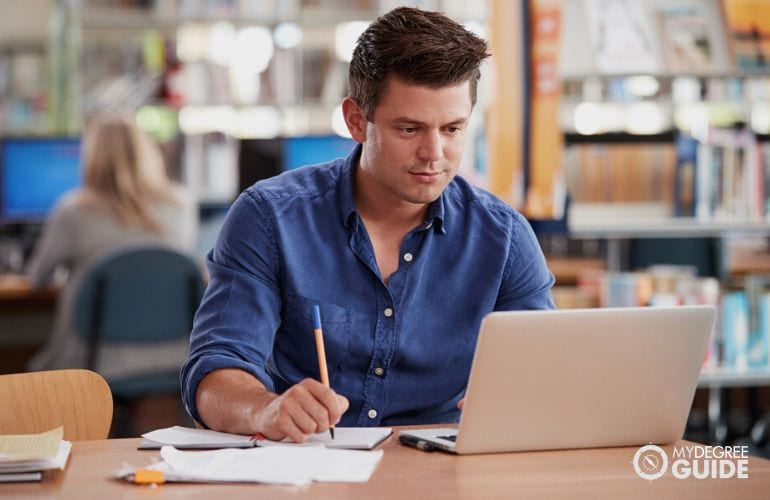 Man taking online Human Development Masters