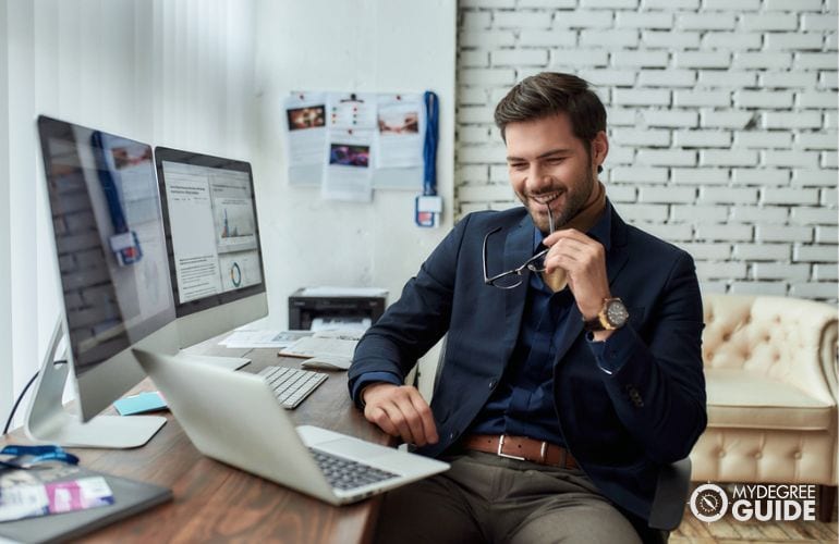 Man with an Online Journalism Degree working in his office