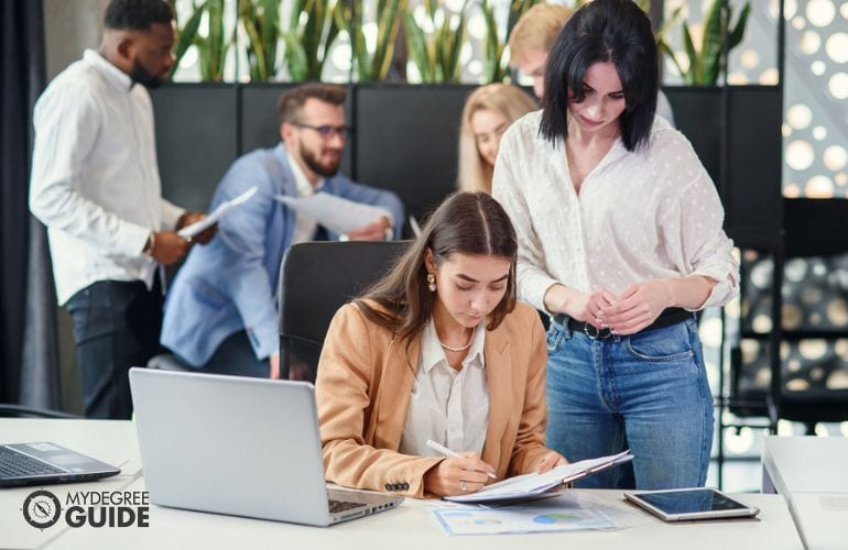 Market research team reviewing survey results together