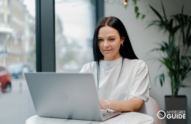 Woman getting her Masters Degree in Biology online 