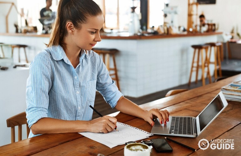 Emergency Management student studying at a cafe