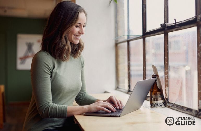 Woman taking Online Masters in Journalism 