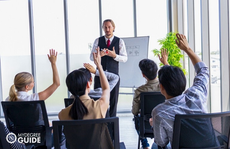 Chief Operating Officer meeting with his staff