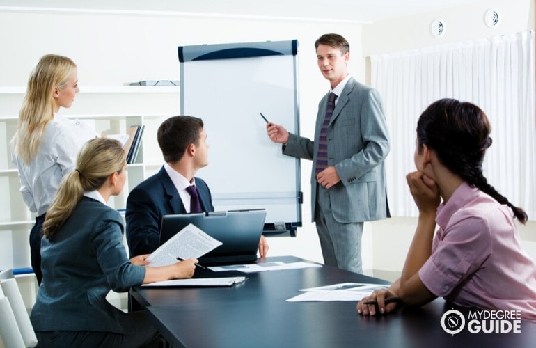 Human Resources Director meeting with his colleagues