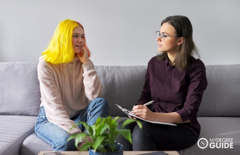 social worker listening to a teenager