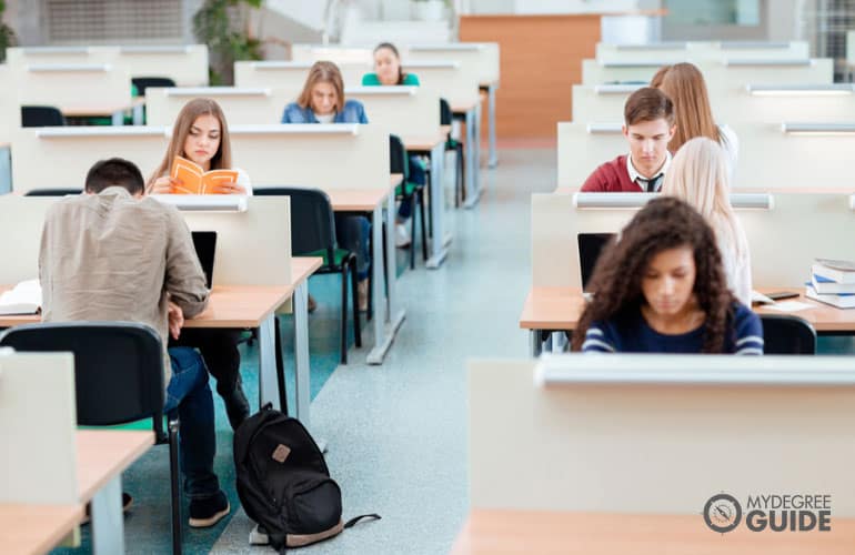 students studying in a college library