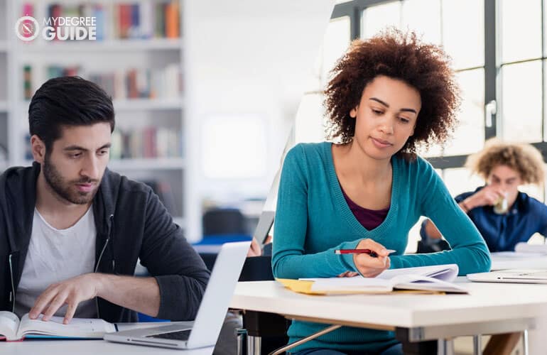 masters of public health students studying on computer and sitting in class respectively