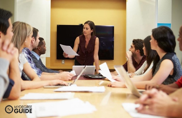 Human Resources Director having a meeting with her staff