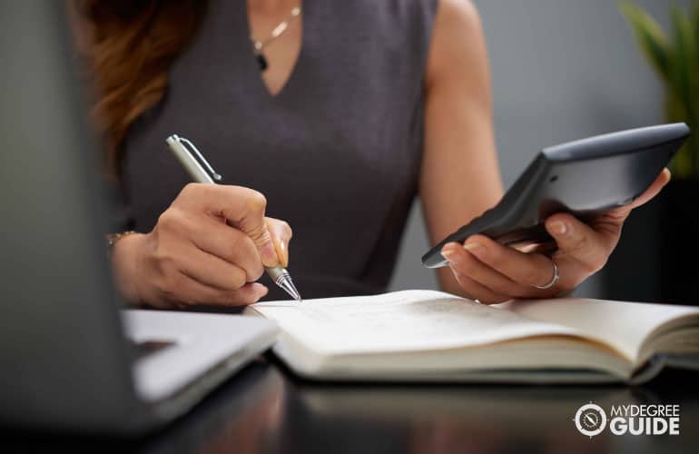 accountant working with a calculator