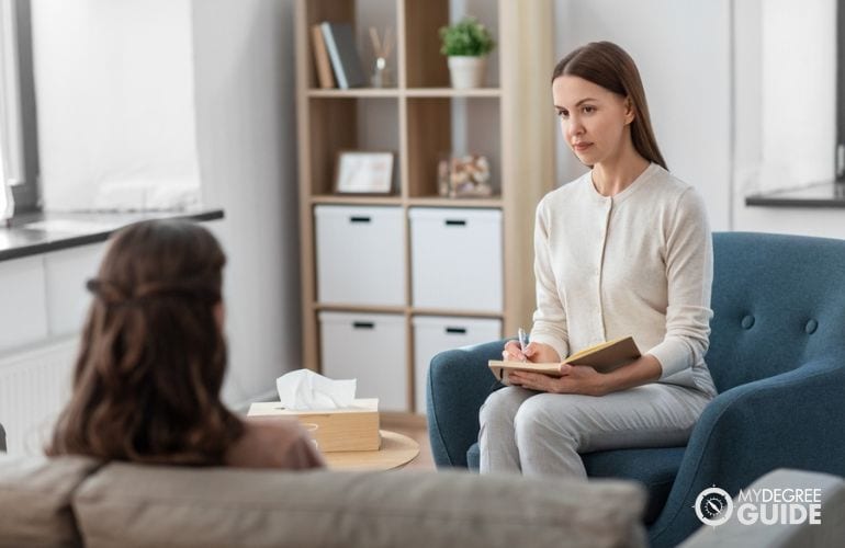 Psychiatric technician observing and listening to the patient